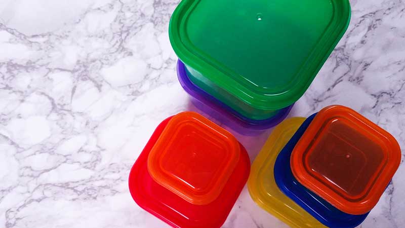 21 day fix containers stacked on a white and gray counter