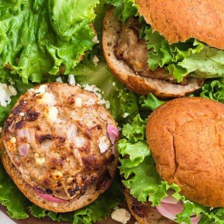 ranch turkey burgers on a bed of lettuce and in whole grain buns