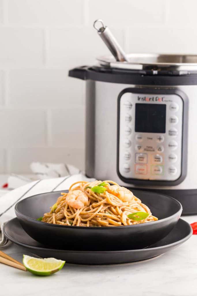 bowl of Bang Bang Shrimp Pasta in front of Instant Pot