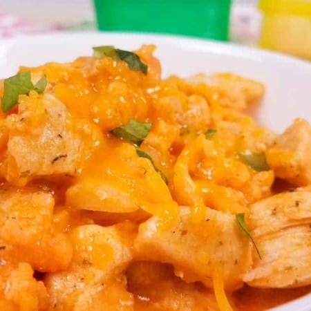 close up of buffalo cauliflower mac and cheese in white bowl