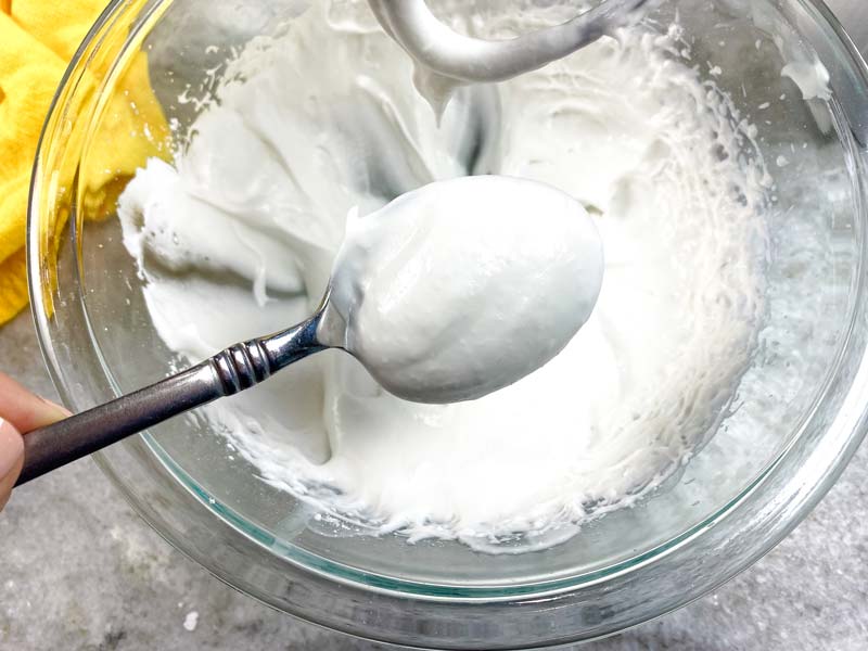 coconut whip cream on a spoon