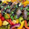 close up of mushrooms and other fajita vegetables