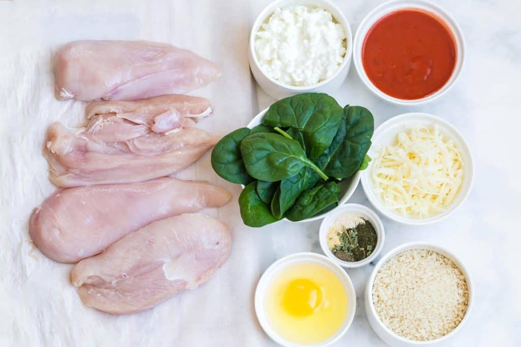 all of the ingredients needed for these roll-ups - on a white counter