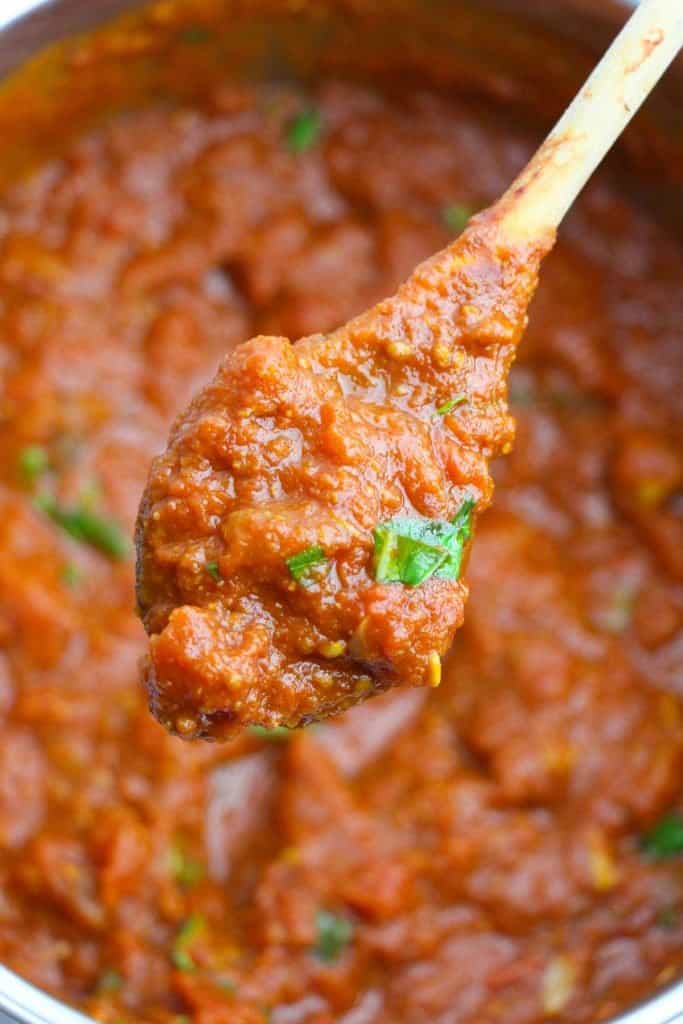 healthy spaghetti sauce on a wooden spoon