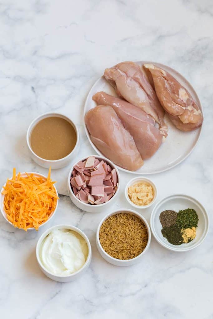 on a white marble countertop, ingredients are on white plates and white bowls. 