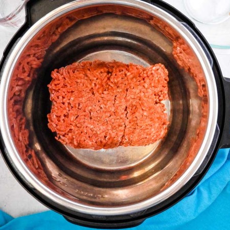 overhead photo of frozen ground beef in the Instant Pot