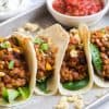 prepared lentil tacos on a white plate