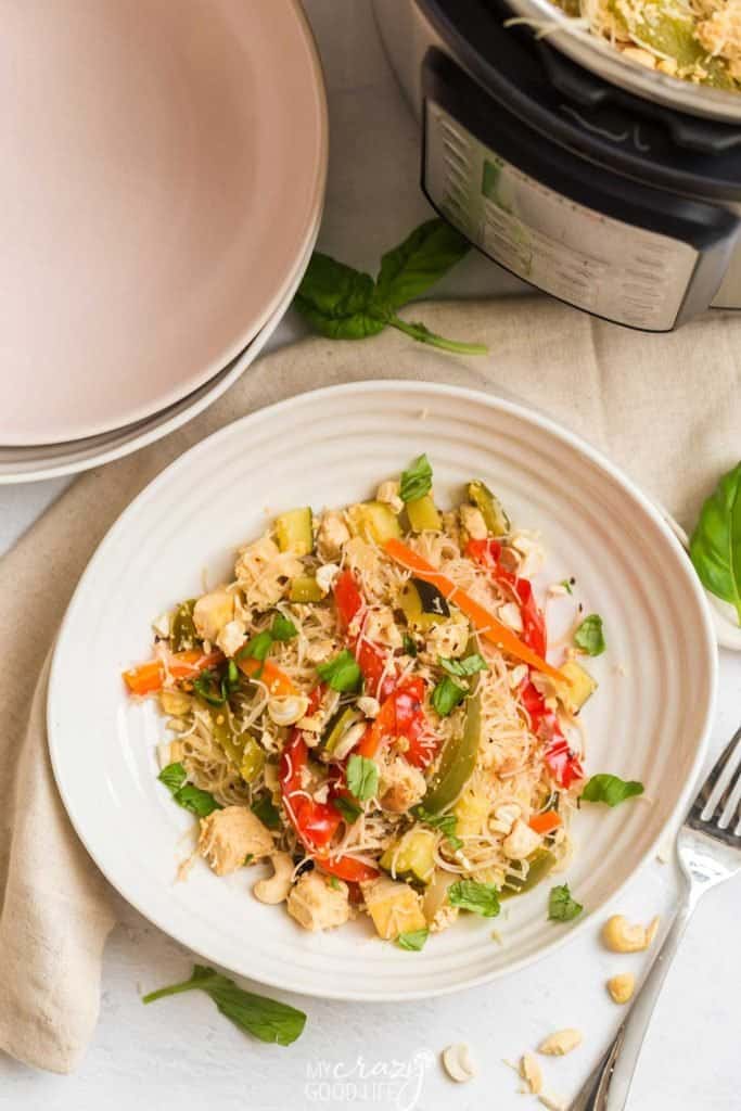 overhead of food on white plate with instant pot in background