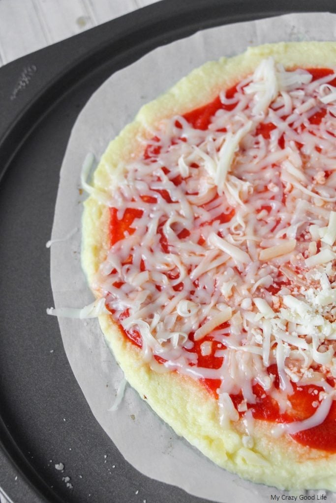 This low carb cauliflower pizza crust is a family favorite! It uses only 3 ingredients and is so easy to make on pizza night! 