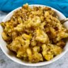 close up of mac and cheese with breadcrumbs in white bowl