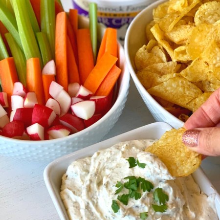 ranch crack dip in a white bowl with chip dip