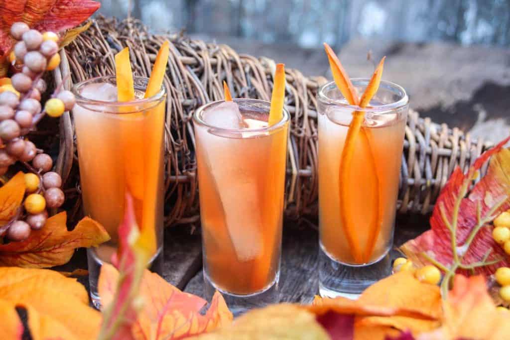 image of three glasses of Apple Cider Margarita Shooters with pumpkin zest