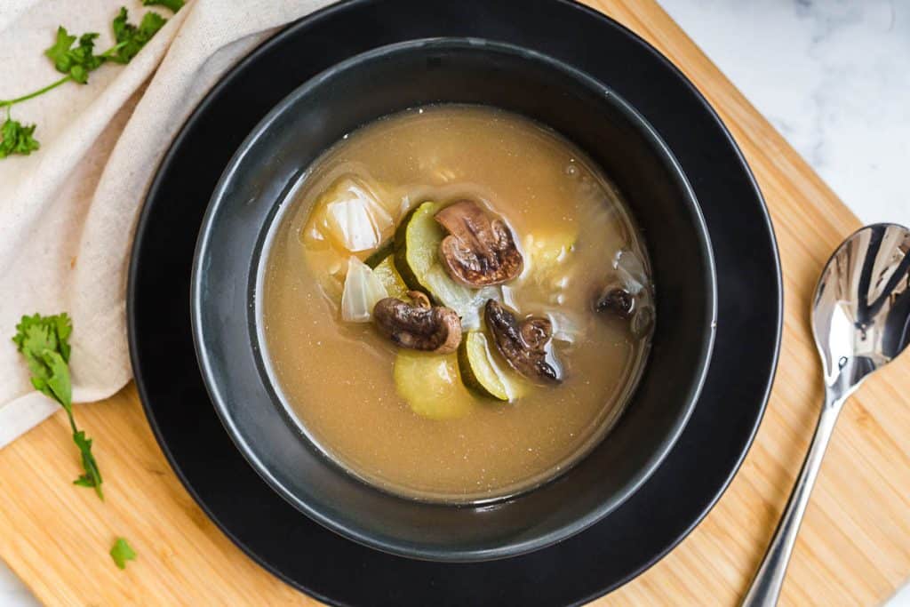 aerial view of black bowl of Bone Broth Soup