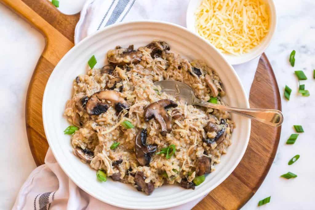 white plate with chicken mushroom risotto