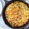 zucchini sausage casserole in a cast iron skillet