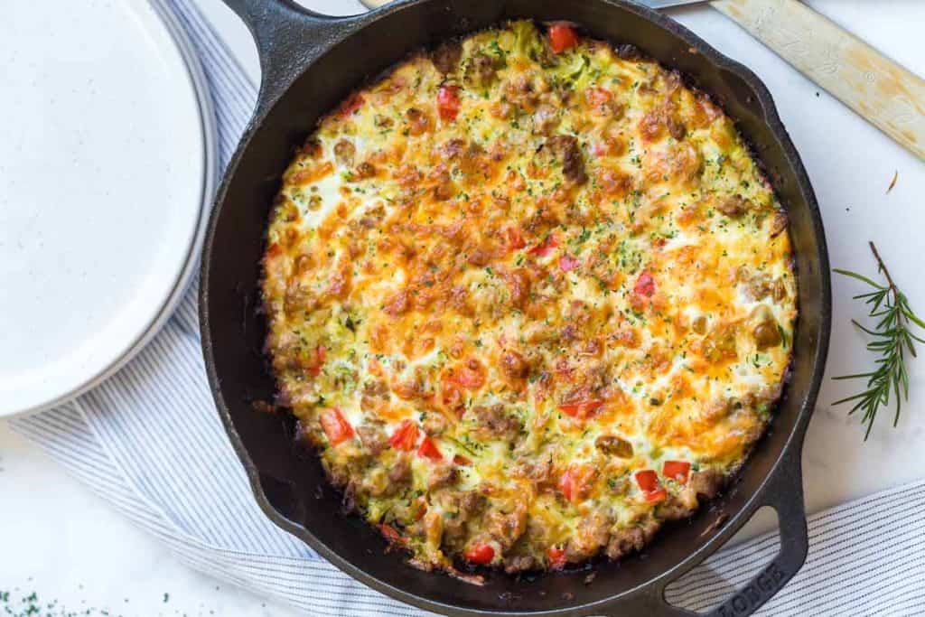 zucchini sausage casserole in a cast iron skillet