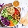 overhead image of salad bowl full of ingredients ready to be mixed together