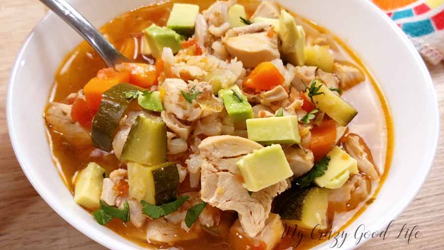 rotisserie chicken soup in a white dish.