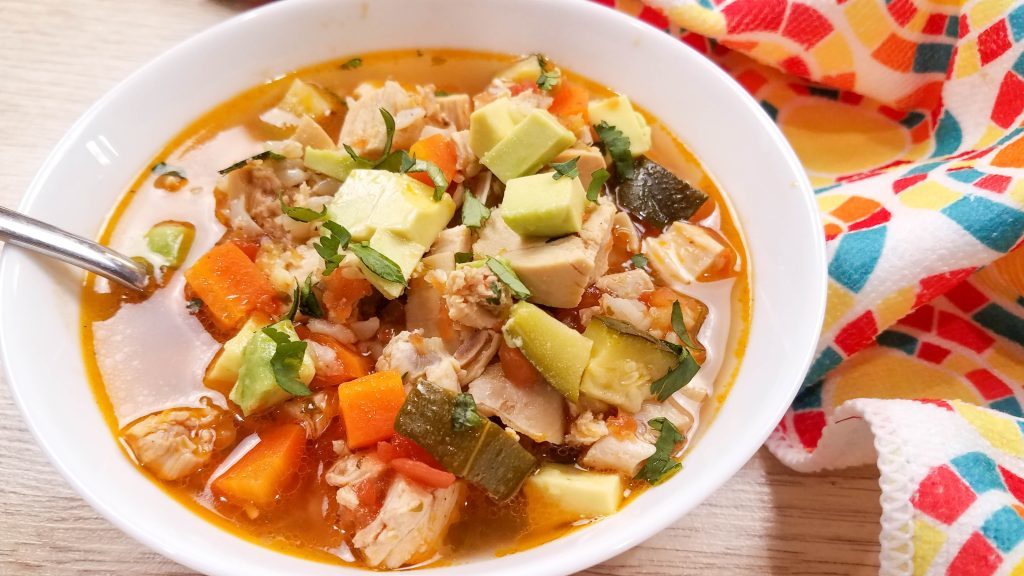 image of white bowl of chicken soup with veggies