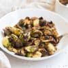 teriyaki brussels sprouts in a white bowl