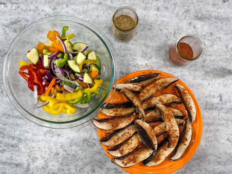 image of raw mushrooms and vegetables, ready to grill