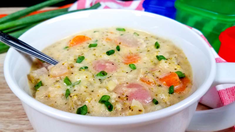 close up of vegetable soup in a white bowl