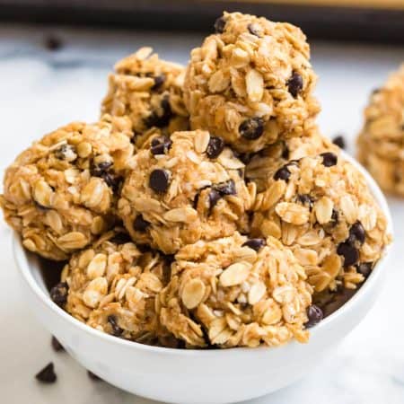 white bowl with ready to eat protein balls stacked inside.