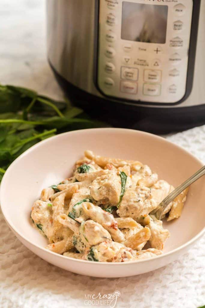 white bowl of ww tuscan chicken and pasta