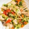 top down view of instant pot chicken lo mein with zoodles in a white bowl and chopsticks